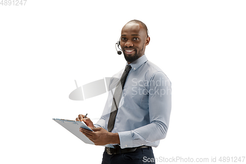 Image of Young african-american call center consultant with headset isolated on white studio background