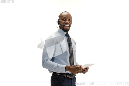 Image of Young african-american call center consultant with headset isolated on white studio background