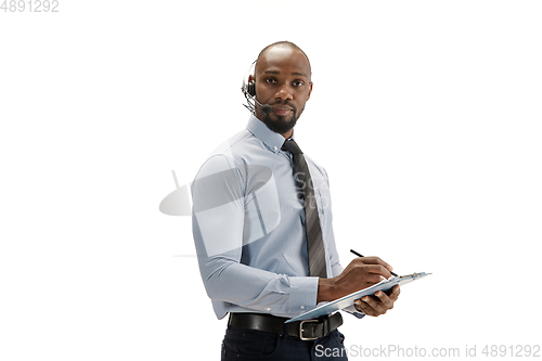 Image of Young african-american call center consultant with headset isolated on white studio background