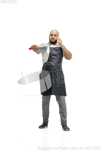 Image of Portrait of a male chef cook, butcher isolated on a white studio background