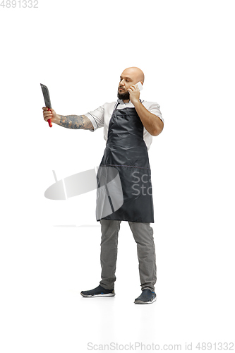 Image of Portrait of a male chef cook, butcher isolated on a white studio background