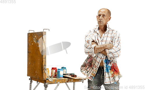 Image of Artist, painter at work isolated on white studio background