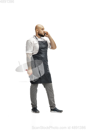 Image of Portrait of a male chef cook, butcher isolated on a white studio background