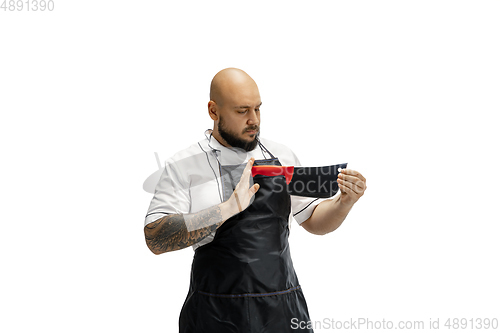 Image of Portrait of a male chef cook, butcher isolated on a white studio background