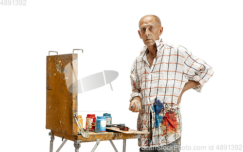 Image of Artist, painter at work isolated on white studio background