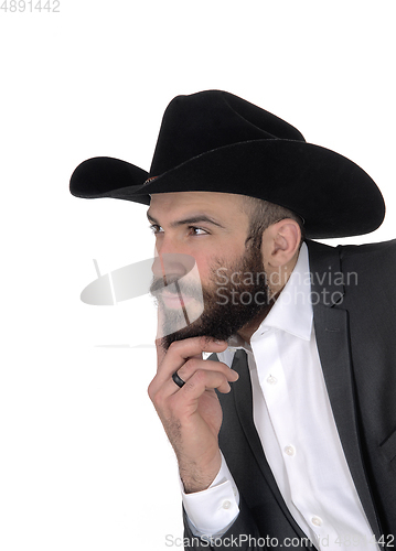 Image of Close-up portrait of man in a suit and cowboy hat