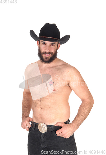 Image of Shirtless man with a cowboy hat, looking at the camera