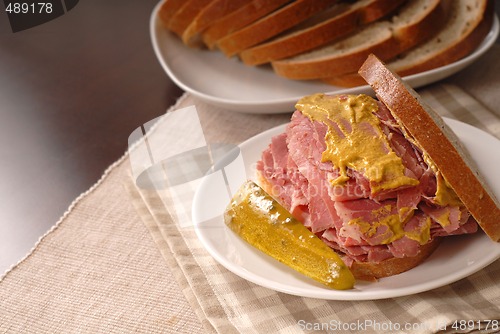 Image of Corned beef sandiwich with mustard on rye