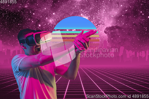 Image of Synth wave and retro wave, vaporwave futuristic aesthetics. Man with device in glowing neon style.