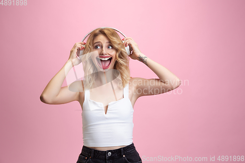 Image of Smiling girl with surreal huge smile and big mouth looks shocked, attracted, wondered and astonished. Copyspace for ad.