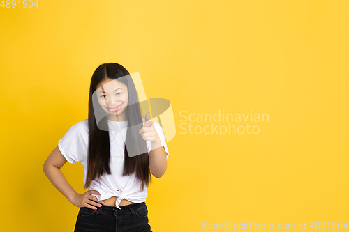 Image of Smiling girl with surreal huge smile and big mouth looks shocked, attracted, wondered and astonished. Copyspace for ad.