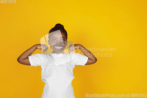 Image of Smiling girl with surreal huge smile and big mouth looks shocked, attracted, wondered and astonished. Copyspace for ad.