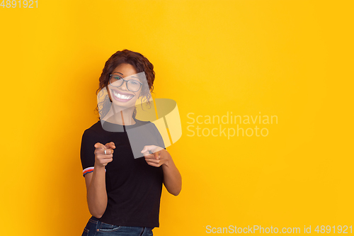 Image of Smiling girl with surreal huge smile and big mouth looks shocked, attracted, wondered and astonished. Copyspace for ad.