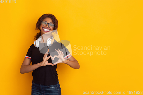 Image of Smiling girl with surreal huge smile and big mouth looks shocked, attracted, wondered and astonished. Copyspace for ad.