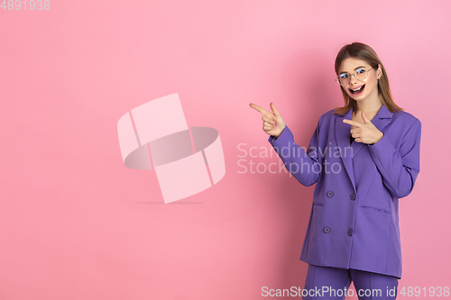 Image of Smiling girl with surreal huge smile and big mouth looks shocked, attracted, wondered and astonished. Copyspace for ad.