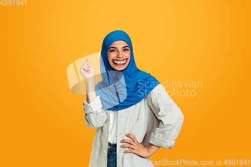 Image of Smiling girl with surreal huge smile and big mouth looks shocked, attracted, wondered and astonished. Copyspace for ad.