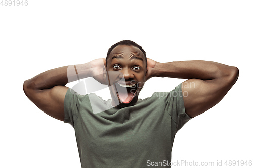 Image of Smiling man with surreal huge smile and big mouth looks shocked, attracted, wondered and astonished. Copyspace for ad.