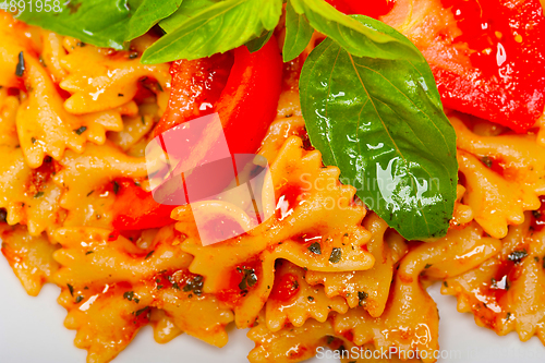 Image of Italian pasta farfalle butterfly bow-tie and tomato sauce