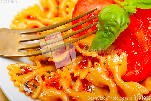 Image of Italian pasta farfalle butterfly bow-tie and tomato sauce