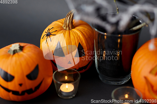 Image of pumpkins, candles and halloween decorations