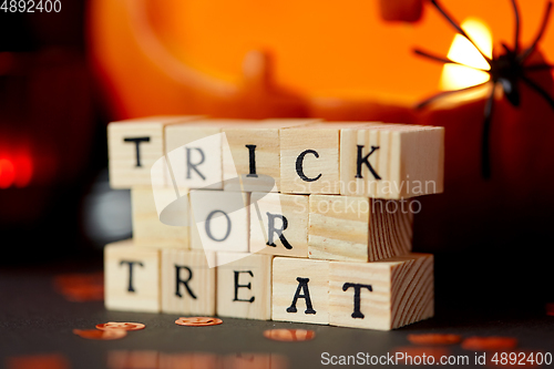 Image of toy blocks with trick or treat words on halloween