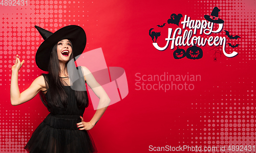 Image of Young woman a witch on scary background