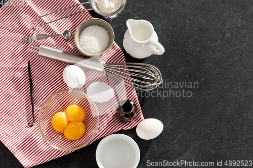 Image of whisk, eggs, sugar, milk, flour and vanilla