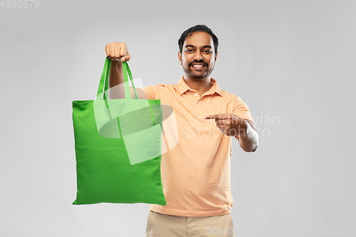 Image of man with reusable canvas bag for food shopping