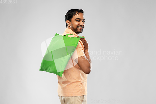 Image of man with reusable canvas bag for food shopping