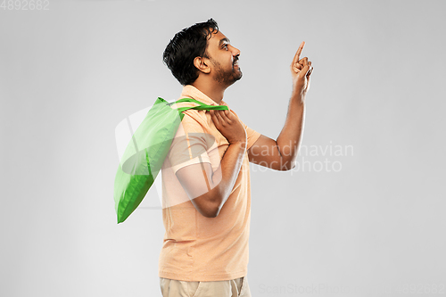 Image of man with reusable canvas bag for food shopping