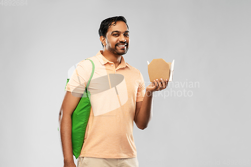 Image of man with reusable shopping bag and takeout food