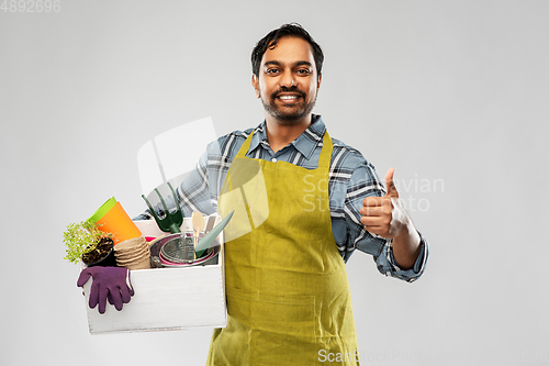 Image of indian gardener or farmer with box of garden tools