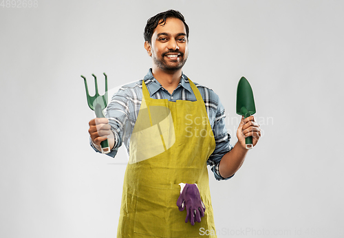 Image of indian gardener or farmer with box of garden tools