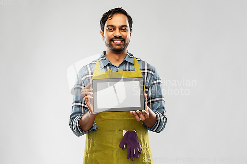 Image of indian male gardener or farmer with tablet pc