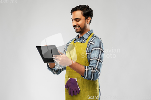 Image of indian male gardener or farmer with tablet pc