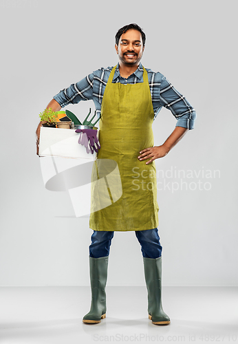 Image of indian gardener or farmer with box of garden tools