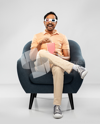 Image of happy man in 3d movie glasses eating popcorn