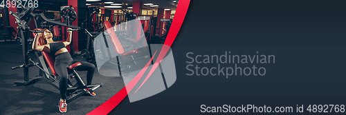 Image of Female athlete training hard in the gym. Fitness and healthy lifestyle concept. Flyer with copyspace.
