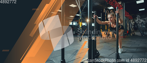 Image of Female athlete training hard in the gym. Fitness and healthy lifestyle concept. Flyer with copyspace.