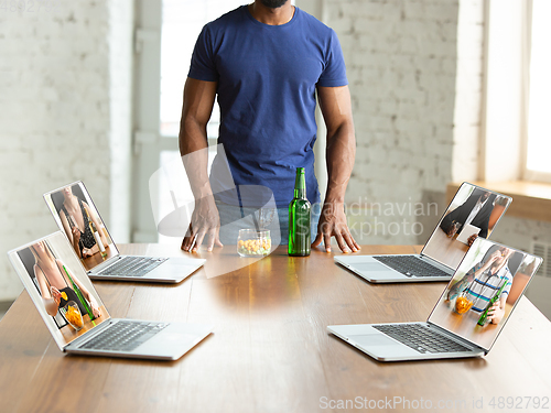 Image of Virtual talking with friends, celebrating and drinking alcohol. All the meetings coming to remote way during coronavirus quarantine