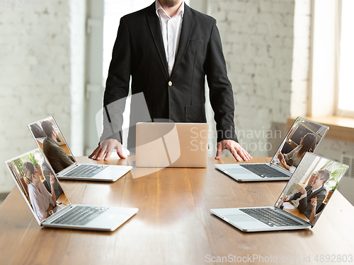 Image of Business meeting online during coronavirus quarantine. All the meetings coming to remote way, office work