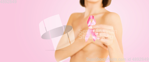 Image of woman with pink breast cancer awareness ribbon