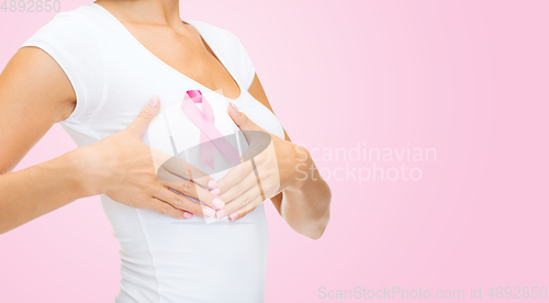 Image of woman with pink breast cancer awareness ribbon
