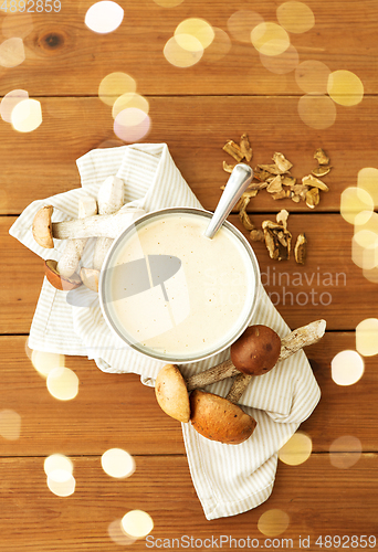 Image of mushroom cream soup in bowl on cutting board