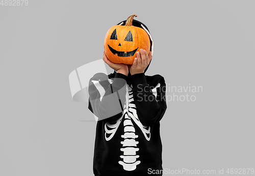 Image of boy in halloween costume with jack-o-lantern