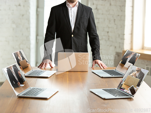 Image of Business meeting online during coronavirus quarantine. All the meetings coming to remote way, office work