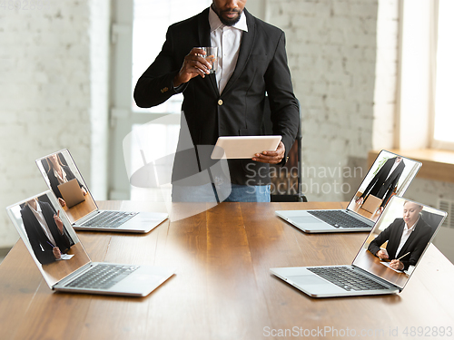 Image of Business meeting online during coronavirus quarantine. All the meetings coming to remote way, office work