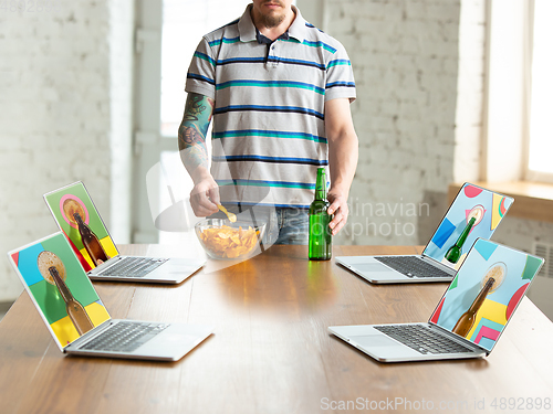 Image of Virtual talking with friends, celebrating and drinking alcohol. All the meetings coming to remote way during coronavirus quarantine