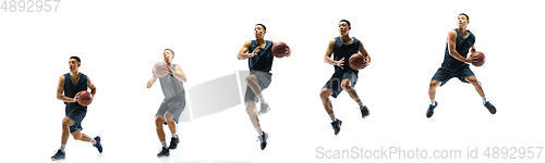 Image of Young basketball player against white studio background in motion of step-to-step goal