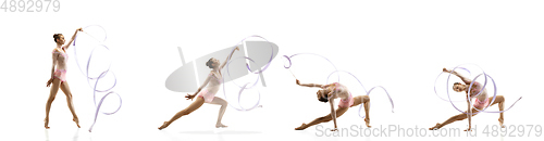 Image of Little flexible girl isolated on white studio background. Little female rhythmic gymnastics artist in bright leotard